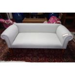 A contemporary sofa, stone linen upholstery, raised on turned legs, H.64 W.134 D.55cm