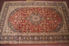 A Central Persian Kashan carpet, central double pendent medallion with repeating spandrels on a