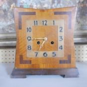 An Art Deco walnut clock, the movement stamped 'times money', H.29 W.28 D.13cm