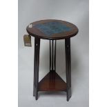 An Arts and Crafts mahogany jardiniere stand with tile top, H.69cm