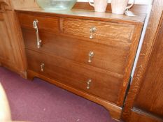 An oak chest of two short over two long drawers, raised on bracket feet, H.80 W.99 D.45cm