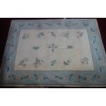 A large woolen carpet with floral design on a cream ground, 313 x 230cm