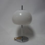 A contemporary chrome table lamp