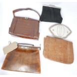 A collection of handbags and clutches, to include a snakeskin handbag, snakeskin clutch, and two