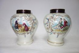 A pair of hand painted baluster form temple jars. H.26cm