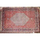 A Bidjar rug, with central floral diamond medallion, on a blue ground, contained by geometric motifs