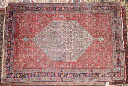 A Bidjar rug, with central floral diamond medallion, on a blue ground, contained by geometric motifs