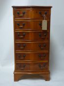 A serpentine fronted yew wood pedestal chest of six drawers, raised on bracket feet, H.98 W.50 D.