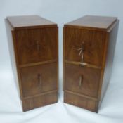A pair of Art Deco walnut pedestal chests, with two drawers raised on plinth base, H.63 W.29 D.39cm