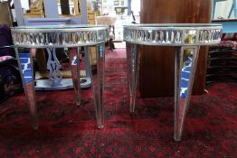 A pair of contemporary mirrored side tables, with glass tops, raised on tapered legs, H.71 W.63cm