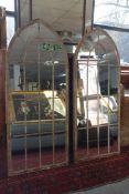 A pair of arched garden mirrors, 158 x 67cm (2)