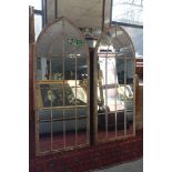 A pair of arched garden mirrors, 158 x 67cm (2)