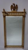 A Regency style pier mirror, with eagle finial above reeded columns, 143 x 71cm