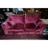 A Heals Red velvet two seat sofa