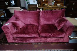 A Heals Red velvet two seat sofa