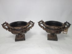 A pair of 18th century style urns, H.30 W.46 D.32cm