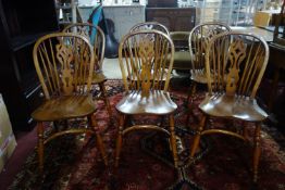 A set of six cherry wood dining chairs