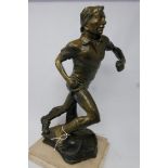 A vintage Continental cast metal figure of a footballer. H.44cm