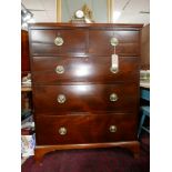 A Regency mahogany chest, two short over three long drawers, raised on bracket feet, H.131 W.104 D.