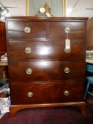 A Regency mahogany chest, two short over three long drawers, raised on bracket feet, H.131 W.104 D.