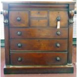 A 19th century Scottish mahogany chest, with secret drawer above four short and three long