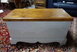 A white painted pine blanket box with twin carrying handles, H.50 W.95 D.45cm