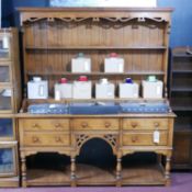 A cherry wood dresser with 12 drawers, H.194 W.168 D.50cm