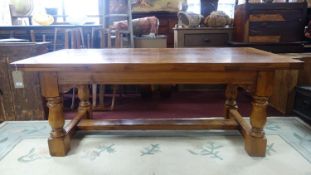 A cherry wood extending dining table with two leaves, H.74 W.198 closed W.304 with leaves D.100cm