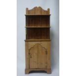 A narrow small pine cabinet, H.137 W.51 D.20cm