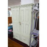 A Halo cream painted wardrobe with drawers, H.198 W.126 D.63cm