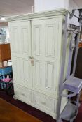 A Halo cream painted wardrobe with drawers, H.198 W.126 D.63cm