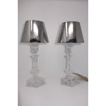 A pair of Baccarat crystal table candle holders in the form of lamps, by Phillipe Starck, H.33cm, in