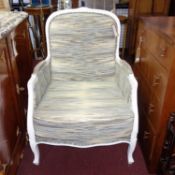 A Louis XV style cream painted armchair, recently upholstered in designer guild fabric