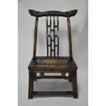 An early 20th century Chinese hardwood and part lacquered chair with carved back rest, H.86 W.47 D.