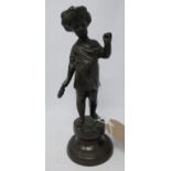 A bronze figure of a standing cherub on socle base. H.26cm