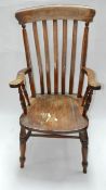 An early 20th century oak Windsor armchair