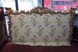 A Rococo style gilt wood bedhead, 110 x 208cm