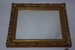 A 19th century gilt framed rectangular wall mirror with foliate acanthus leaf decoration. H.74 W.