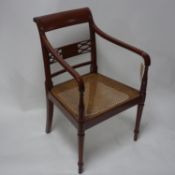 A 19th century mahogany desk chair with cane seat