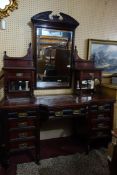 A Victorian mahogany dressing table with 11 drawers, raised on turned legs and castors, H.185 W.