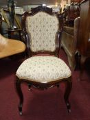 A 19th century French mahogany side chair and a beech ladder back armchair.