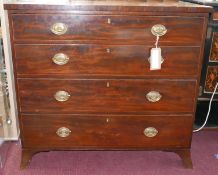 A Regency mahogany and boxwood inlaid chest of four graduating drawers, raised on splayed legs, H.98