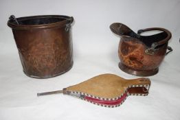 Two copper coal buckets and a pair of bellows