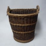 A wicker log basket, H.66 W.57 D.49cm