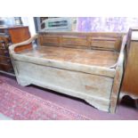 A 19th century Indonesian teak rice bed, with floral carved and slatted backrest, on square legs