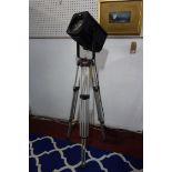 A spot light standard lamp raised on adjustable tripod stand