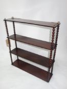 A Victorian mahogany wall hanging shelf, with bobbin turned supports, H.73 W.64 D.17cm