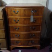 A yew wood chest of five drawers raised on bracket feet, H.104 W.74 D.44cm