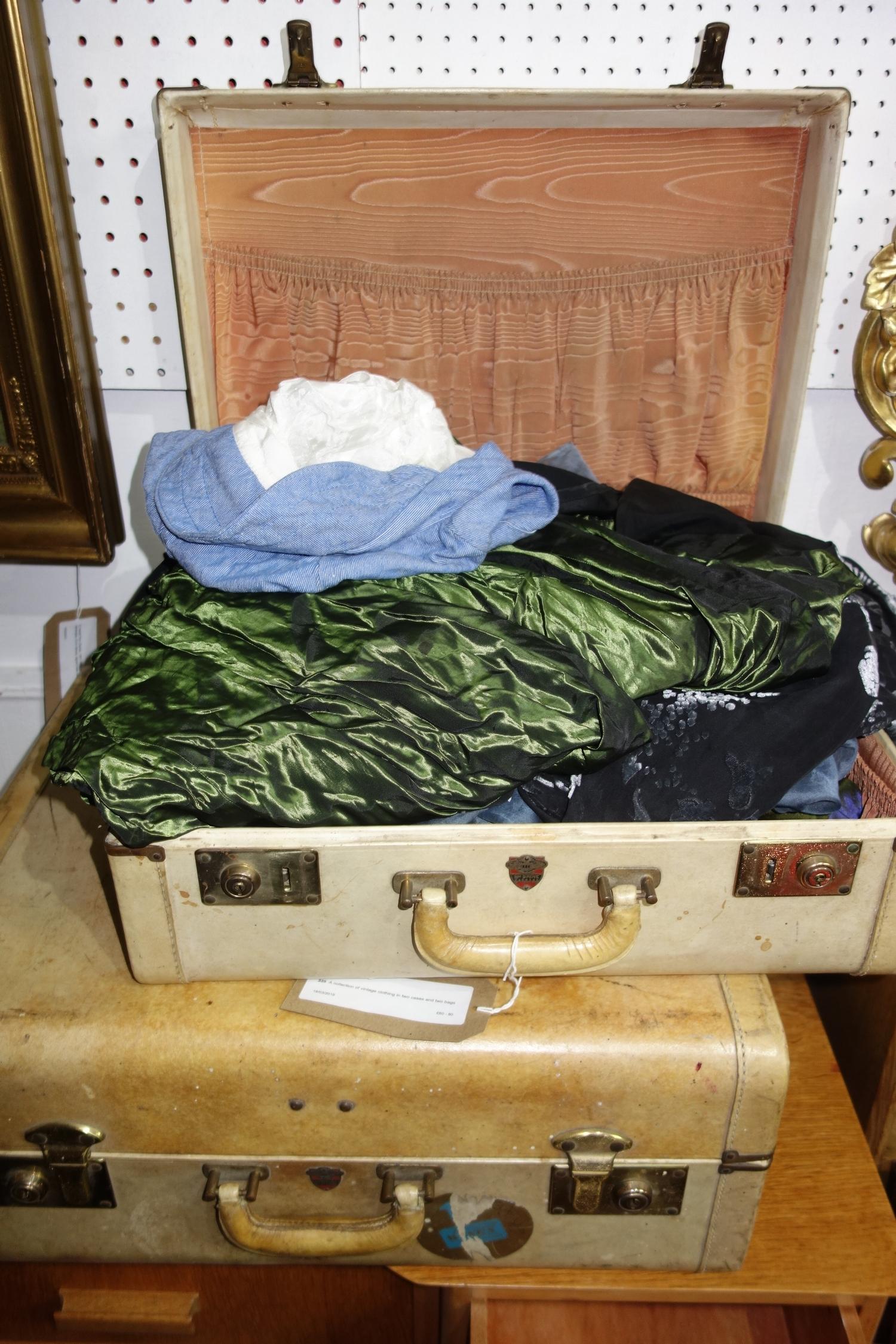 A collection of vintage clothing in two cases and two bags