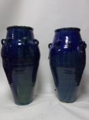 A pair of Persian blue glazed Sharab wine vessels, H.90cm (2)